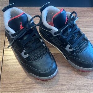 Air Jordan 4 retro. Kids unisexBlack and Red Sneakers